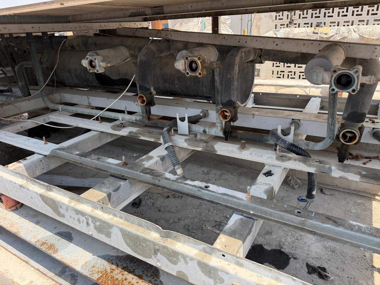 Chilled water pipework and header connections prepared for reassembly during plant maintenance