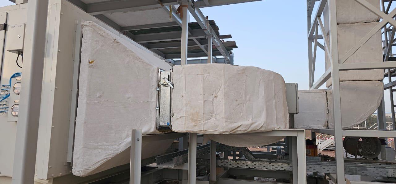 Insulated supply duct connected to an air handling unit with damper access