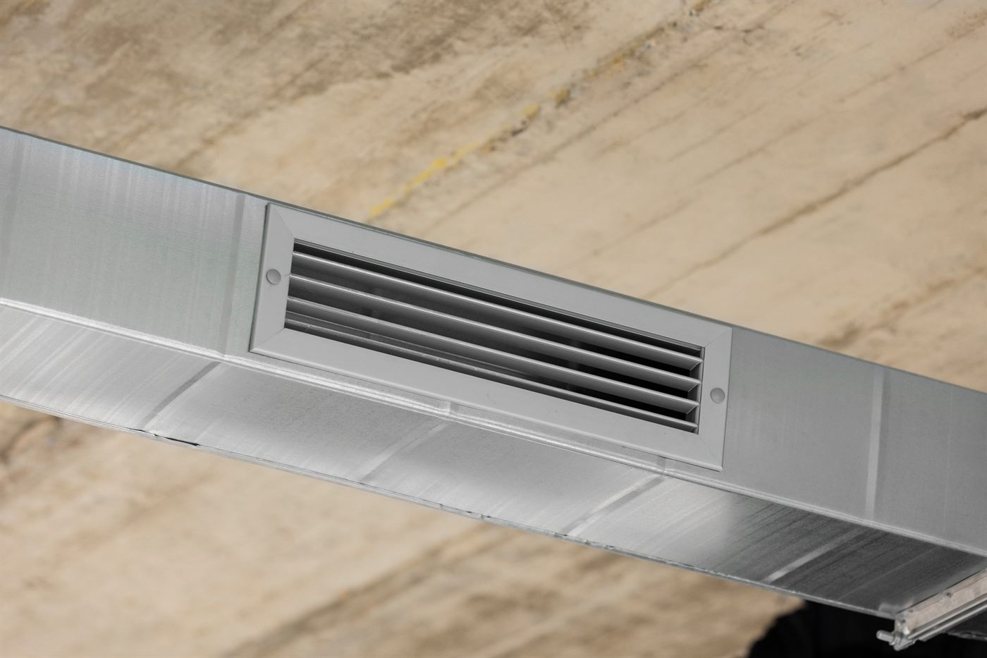Linear ceiling diffuser installed as part of an air distribution system
